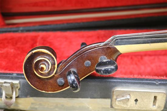 A Rosetti violin bearing faux Stradivarius label, cased with bow
